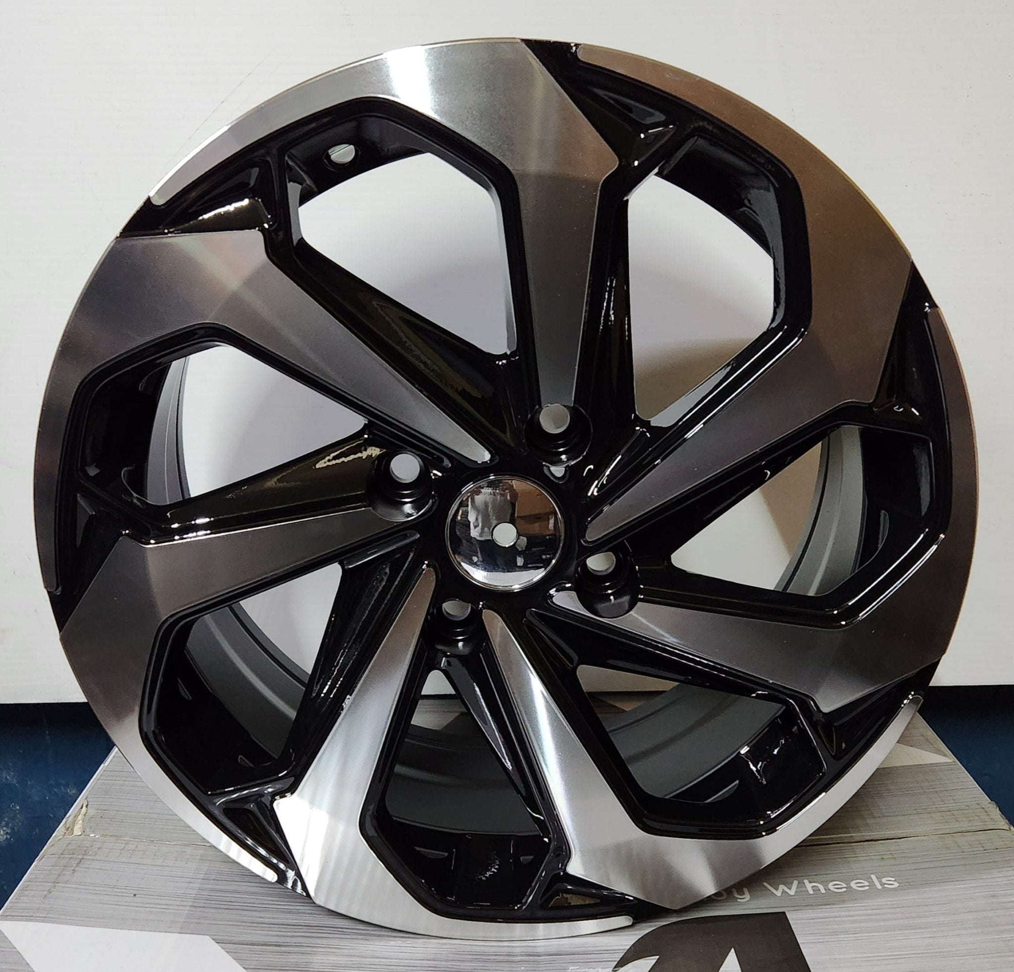 REW005-6 16x7.0 4x114.3 PIANO  BLACK MACHINE FACE