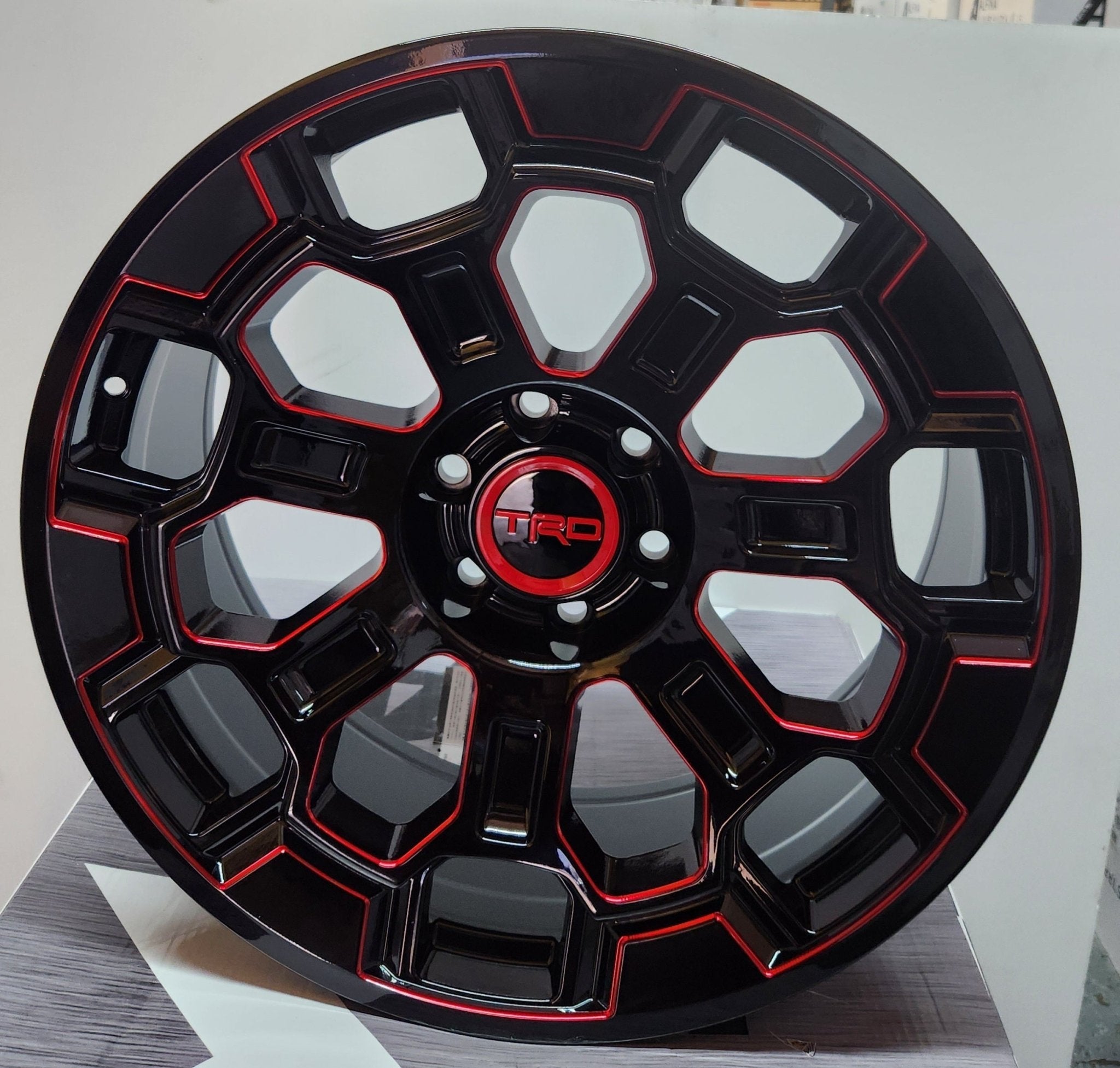 2022 TRD OFF-ROAD 22x9.0 6x139.7 GLOSS BLACK WITH RED MILL FACE